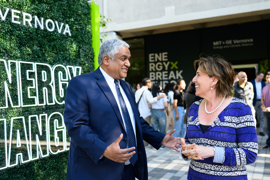 Anantha Chandrakasan and Rebecca Tepper converse at an energy event with “ENERGY CHANGE” and “MIT + GE Vernova” signs in the background.
