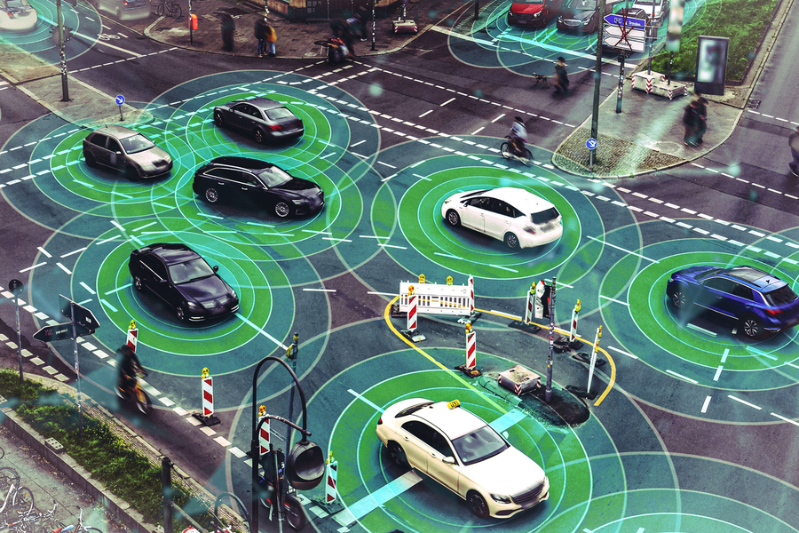 Aerial view of a busy urban intersection overlaid with green concentric sonar rings emanating from multiple vehicles, illustrating connected and autonomous vehicle sensing technology for eco-driving research.