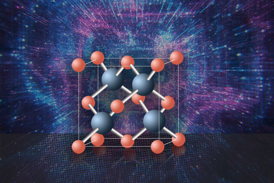 3D molecular model of a semiconductor crystal lattice showing alternating blue-gray and salmon-colored atoms arranged in a cubic unit cell against a blue starburst background.