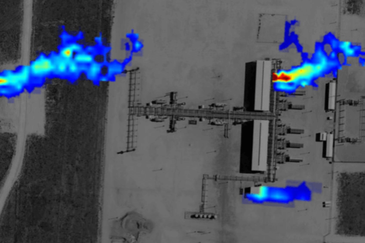 Aerial lidar scan of a natural gas facility overlaid with heat map showing methane emissions plumes in red, orange, and blue against a grayscale satellite image.