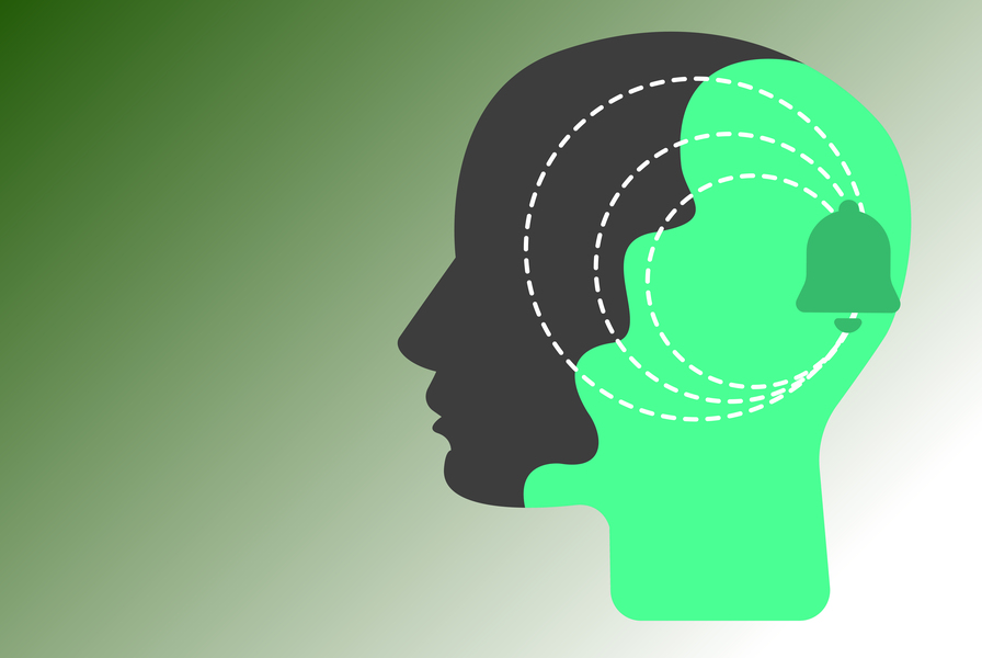 Minimalist graphic illustration of two overlapping human head silhouettes — one dark gray and one bright green — with concentric dashed rings and a bell icon representing sensory prediction and auditory awareness under anesthesia.